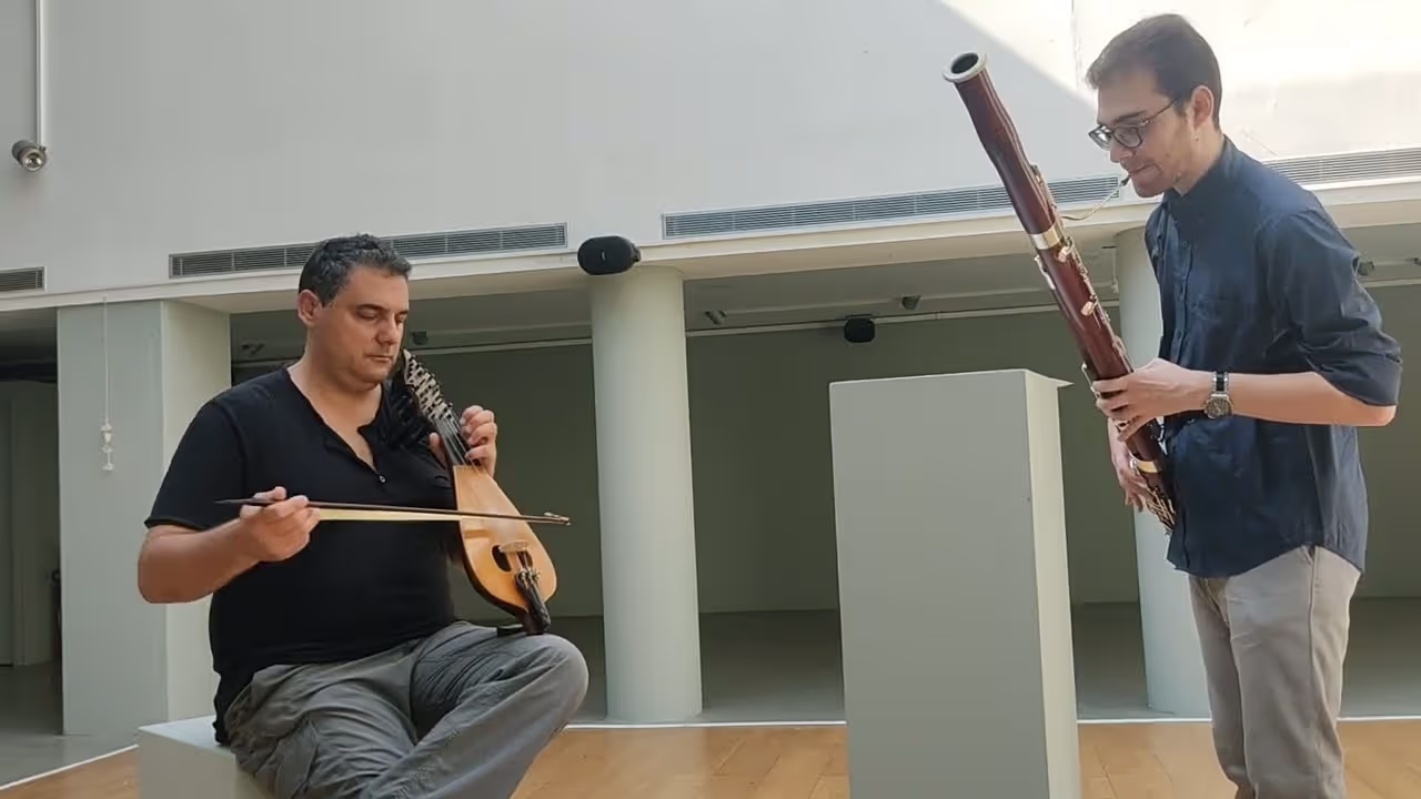 Periklis Kotinis and George Athanasopoulos  performing a peice. Periklis is playing the bassoon and George is playing the lyre
